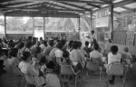 Krishna Seegopaul speaking, Counsellor Donald Witzel front row left, Bahá’í youth camp near Georgetown (12/75)