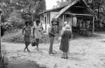 Counsellor Leonora Armstrong speaking with Seigfried Franklin and Ed Widmer, Bahá’í youth camp near Georgetown (12/75)