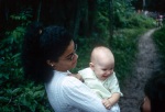 Dawn Smith with the baby Angeline Ann Widmer, Bahá’í youth camp near Georgetown (12/75)