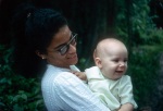 Dawn Smith with the baby Angeline Ann Widmer, Bahá’í youth camp near Georgetown (12/75)