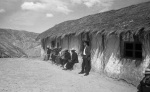 Francisco, the school teacher, and friends waiting in front of the Bahá’í school in Jankarachi, which was built by the villagers