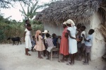 Carrie Smith-Dahl with villagers near Port-au-Prince (7/82)