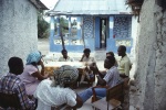 Gwili Posey and Alanna Robinson Vreeland (obscured) visiting a village near Port-au-Prince (7/82)