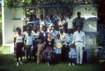 Rúhíyyih Khánum with friends, Auxiliary Board member Joe Cobletz behind her, at the home of Michael Bannister, Les Cayes (10/82)