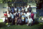 Rúhíyyih Khánum with friends, Auxiliary Board member Joe Cobletz behind her, Violette Nakhjavani far right, Michael Bannister crouching front right, at Michael’s home, Les Cayes (10/82)