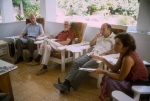 Hans Thimm, Glen Eyford, Counsellor Farzam Arbab, Linda Gershuny, meeting of the Administrative Council of the Anís Zunúzí Bahá'í School (6/83)