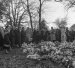 The Guardian's funeral, at grave after graveside service, Rúhíyyih Khánum (center), Mr. Samandari (with cane), 11/57