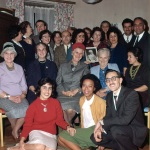 Luxembourg Bahá’ís, Honor Kempton (center, red hat), Joyce Dahl (behind photo of ‘Abdu’l-Bahá) 10/61 (from dupl.)