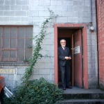 Mark Tobey at the door of his studio, Seattle, 6/62