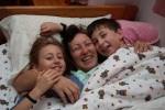 Mommy gets a goodmorning hug from the twins, Blagoevgrad, December