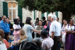 Farewell gathering in front of the Pilgram House near the Shrine of the Báb, with House of Justice member Stephen Birkland, July