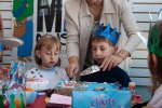 Joyce and Gregory's sixth birthday with school mates at a kids' museum, December