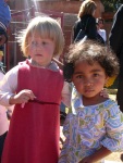 Mina at school with her favorite friend, Marila, and her teachers, June