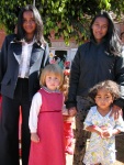 Mina at school with her favorite friend, Marila, and her teachers, June