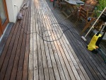 Greg's project to refinish our deck (right is before, left is after), May