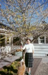 Joyce and Fluffy by the almond tree in our yard, Palo Alto, 3/55