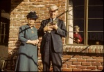 Arthur Sr. & Lenna Dahl in patio, Keith in window, 12/26/1943
