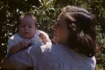 Joyce with baby Roger in garden, 8/11/1946
