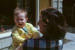 Joyce with baby Roger in patio, 4/47