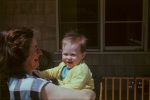 Joyce with baby Roger in patio, 4/47