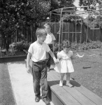Amin and Sheila's daughter w Roger and Gregory, Palo Alto in our back yard (out of focus) 5/29/54