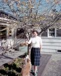 Joyce and Fluffy, Palo Alto: back yard with almond tree in bloom, 3/3/1955
