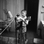 Gregory recording folk songs on tape in our bedroom 4/15/1957