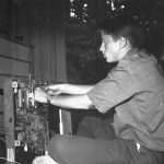 Greg working on old TV in living room 8/30/1964