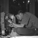 Greg working on old TV in living room 8/30/1964