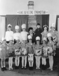 Emi w/ first grade classmates as the Alphabet, by the teacher, c. 1969