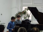 Gregory and David performing at their school, 27 March